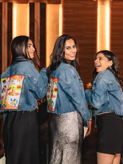 The bride's squad rocking their custom denim jackets.