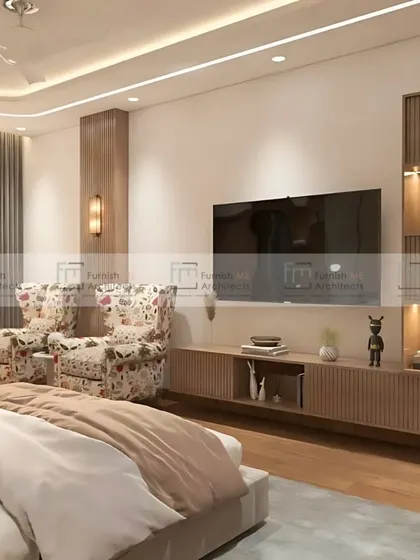 This bedroom features a cozy seating nook with two floral-print wingback chairs. It's the perfect spot for morning coffee or evening reading, adding another layer of comfort and function to the room.