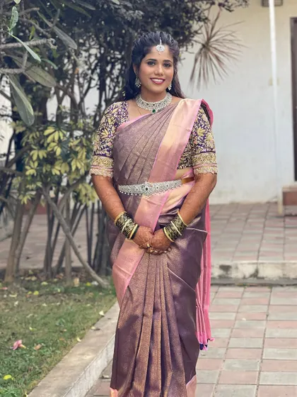 A full-length view of Gagana's beautiful ensemble. The sparkling CZ jewellery adds a touch of glamour to her traditional silk saree.
