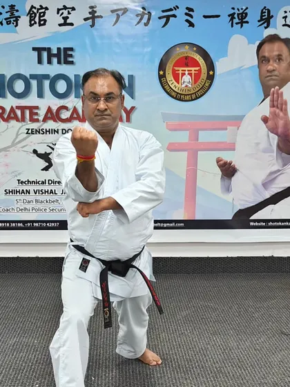 Holding a strong zenkutsu dachi (front stance). Correct stances are the foundation upon which all powerful karate techniques are built.