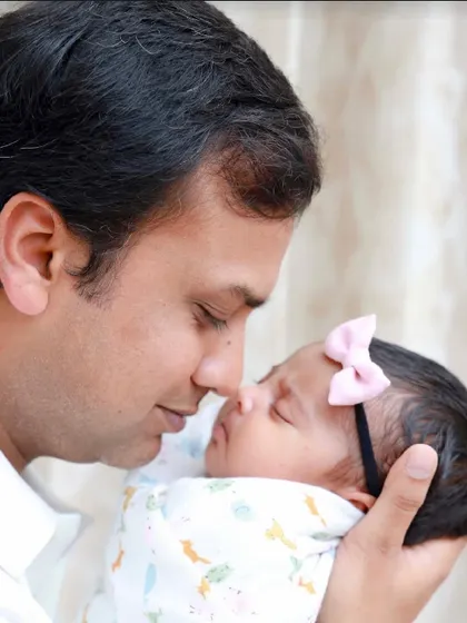 A father and his newborn daughter, nose to nose. A simple, powerful portrait of the bond between a dad and his baby girl.