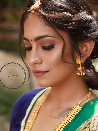 This is a perfect example of a natural South Indian bridal look. The makeup is soft and subtle, with earthy tones on the eyes and a neutral lip, enhancing her natural beauty without feeling heavy. The messy braid adds a touch of modern elegance.