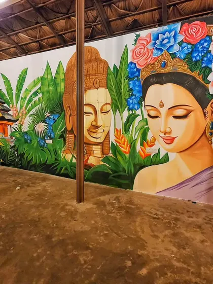 The right side of the Bali mural, focusing on the portrait of a woman adorned with a crown of blue and red flowers, adding a touch of elegance to the scene.