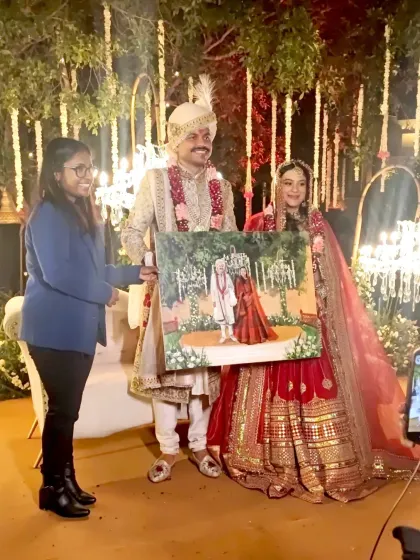 Another happy couple at Heritage Village Resort in Manesar, receiving their custom wedding portrait. This is the moment the live entertainment becomes a treasured family heirloom.