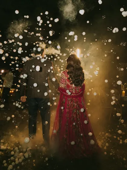 A magical, dreamy shot of the couple. Even from the back, you can see the beautiful flow of her hair and the elegance of her posture.