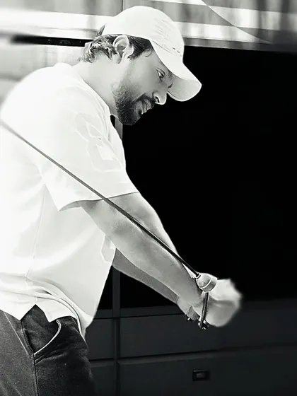 Concentration is key. A black and white shot of me focused during a tricep pushdown exercise.