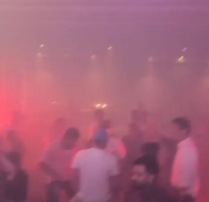 Another shot of the hazy, red-lit dance floor, showcasing the atmospheric effects I use.