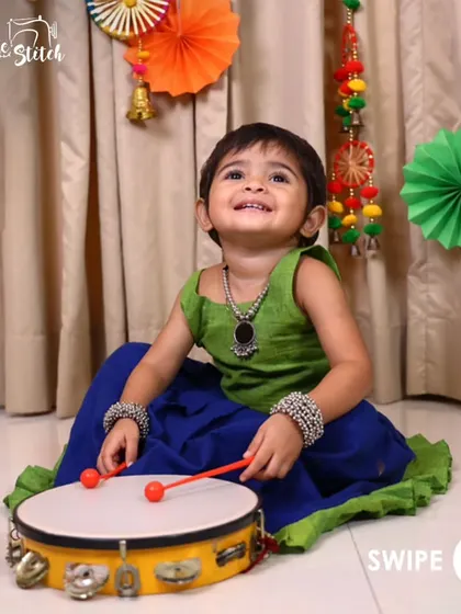 Another look at the playful Nila Ghagra Choli in green and blue. The bright smile on this little one's face is my biggest reward. It’s designed for fun, festive moments.