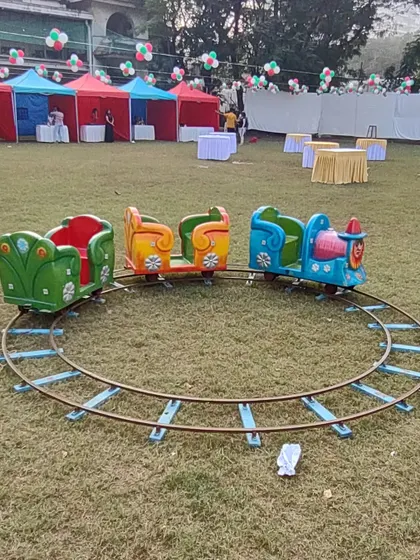 The mini train ride is a classic favorite for children's birthdays and family events. It runs on a simple track that I can set up on grass or a flat surface, offering a gentle and fun ride for the little ones.