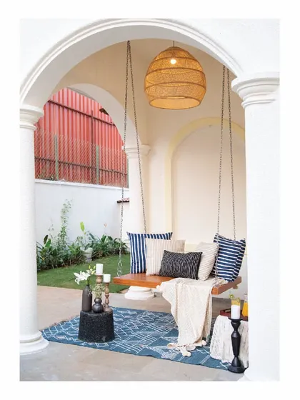 For this Goan villa, we created a serene corner with a classic wooden swing. Set within an arched verandah, it becomes an invitation to slow down and unwind. The design uses natural wood and simple chains, blending perfectly with the tropical, relaxed aesthetic.