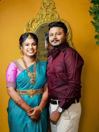A happy portrait of the engaged couple. Sugirtha's makeup looks fresh and beautiful, capturing her joy on this special day.