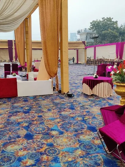 A view across the event floor, showing various furniture elements including covered chairs, round tables, and sofas.