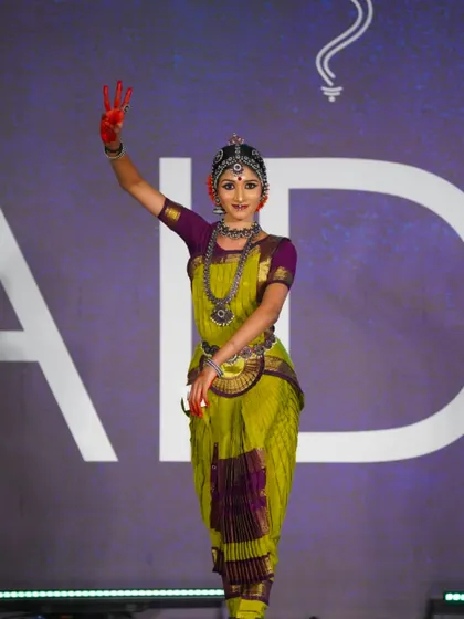 A senior student showcasing a beautiful mudra and serene expression. Her performance was recognized with a 2nd place award in her category.