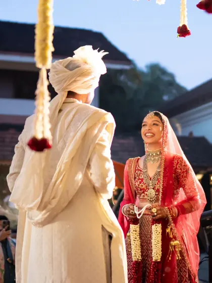 A candid shot of the bride's radiant smile during the jaimala ceremony. This moment captures the pure joy and emotion that I strive to create through thoughtful wedding planning and execution.