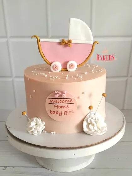 Welcoming a baby girl in the sweetest way! This pretty pink cake features a charming pram topper and was made with no fondant, just clean ingredients and lots of love. Perfect for a baby shower or welcome-home party.