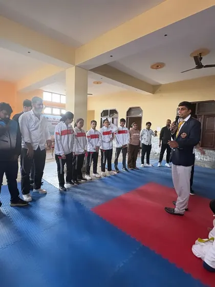 Addressing the students and participants at the start of a championship in 2024.