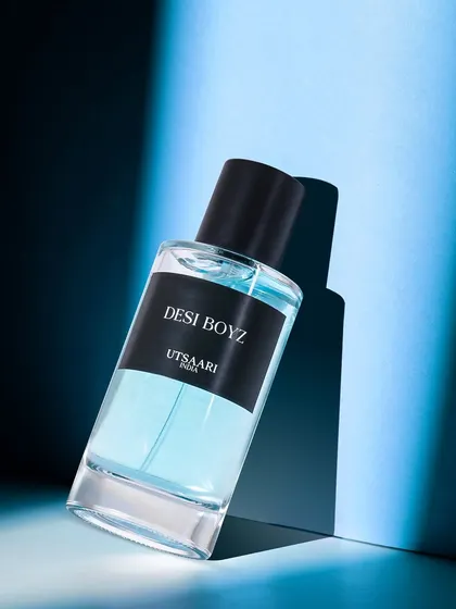 For the 'Desi Boyz' perfume, I used dramatic blue lighting and sharp shadows. This creates a cool, moody, and modern vibe that is perfect for a youthful, masculine fragrance.