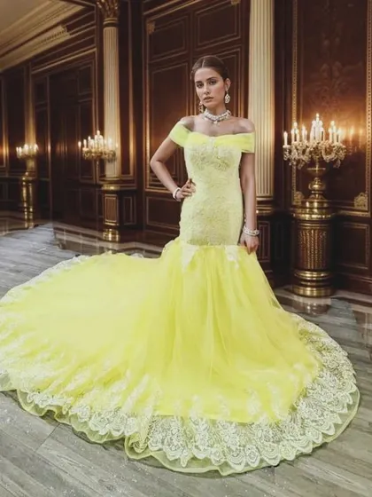 For a truly glamorous look, this yellow fishtail gown with a long lace-trimmed trail is a showstopper. It's perfect for a red-carpet-themed event or a high-fashion photoshoot.