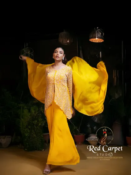 The flowing dupatta of this yellow palazzo set creates a beautiful, dramatic effect. The outfit is designed to move with you, making you feel graceful and free.