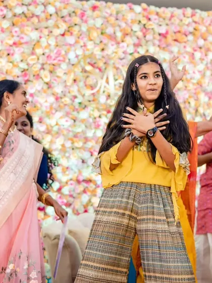 The joy of celebrating with family. This photo captures a happy moment on stage, full of smiles and laughter, which is the ultimate goal of our events.