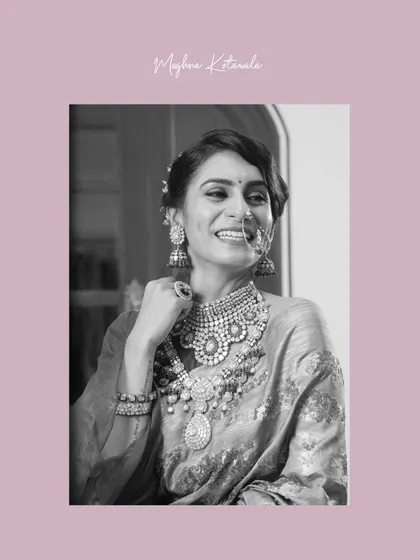 A happy, candid moment captured in black and white. The bride's natural smile and the sparkle of her nose ring and necklace make this a truly special portrait.