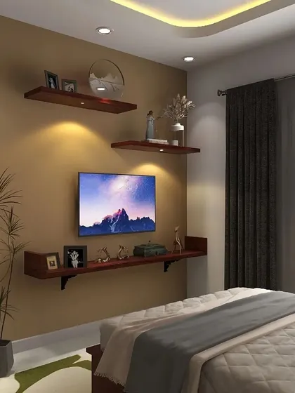 A view of the TV and display shelves opposite the bed. The floating shelves are perfect for personalization with photos and decor items.