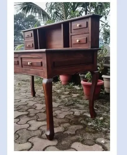 A side view of the vintage-style study table, showing the detail on the curved legs. This kind of woodwork requires careful hand-shaping and finishing.
