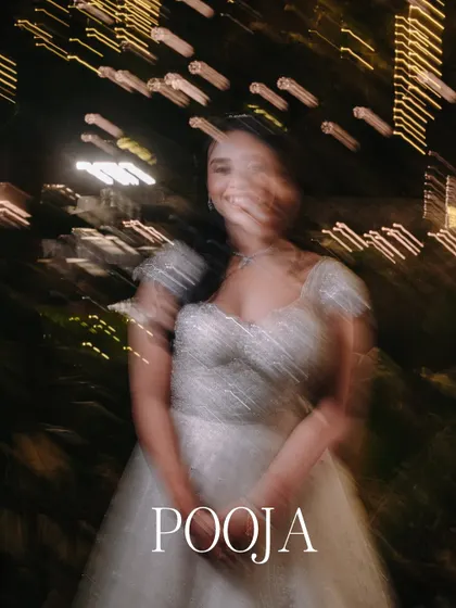 A motion blur shot of the bride, Pooja, adding a creative and dynamic feel to her reception portraits.