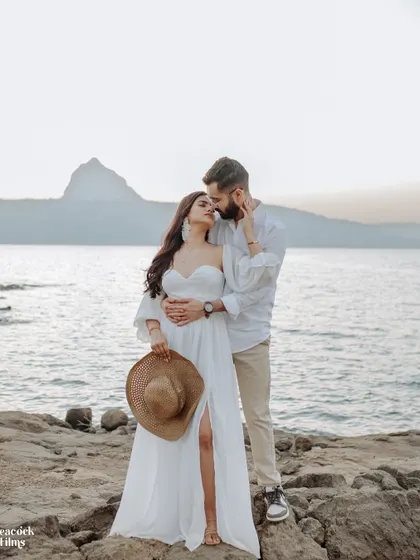 By the serene lakeside at sunset, a quiet promise is shared. This intimate pre-wedding portrait captures the gentle, unspoken bond that forms the foundation of a lifetime together.