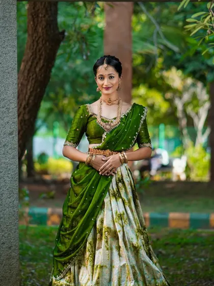 The full look of the green and white half saree, a unique take on festive wear.