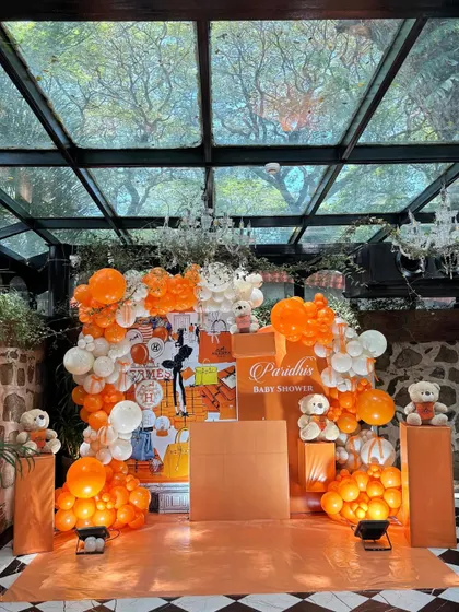 Another view of the Hermès-themed decor, showcasing the custom backdrop and teddy bears with mini Hermès scarves.
