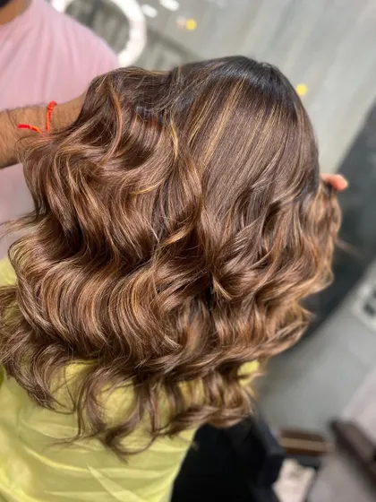 The back of this beautiful balayage, showing the seamless blend of colors and the healthy shine of the hair.