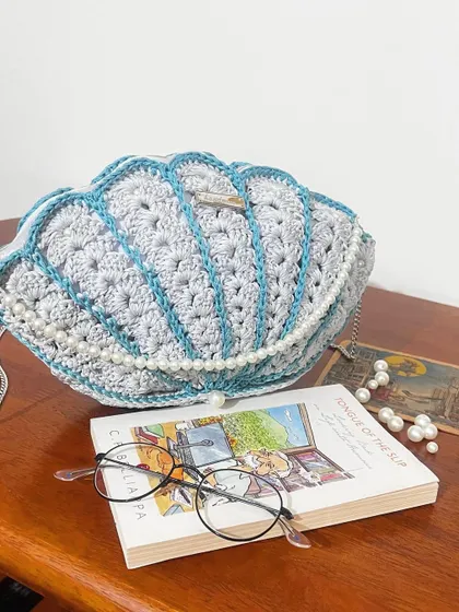The Seashell Bag is one of my favorite custom designs. The combination of crochet and pearls is just so dreamy.
