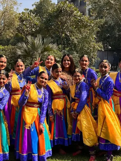 A happy moment with my wonderful students after a performance. Their smiles and victory signs say it all.