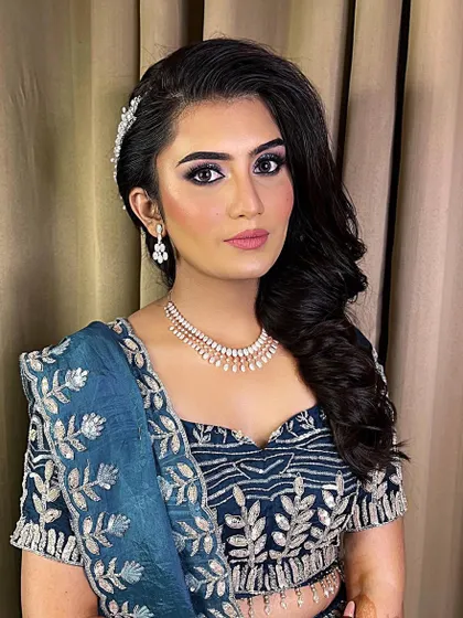 When the bride asks for full glam, we deliver. This look features glittery eyes to match her lehenga, and we're debating between matte and glossy lips. Which do you prefer?
