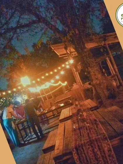 The rustic charm of our farm at dusk. Our open-air dining area is perfect for enjoying the cool evening breeze and a sky full of stars.