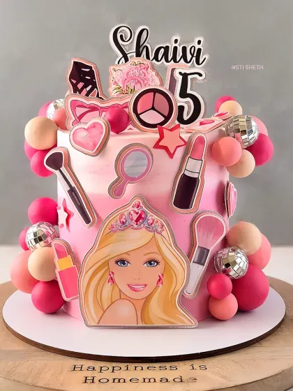 A fun and glamorous Barbie cake for a 5th birthday, featuring makeup and accessory toppers. This is my signature Mocha Orange flavour.