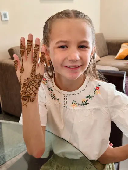 Another happy little client from the UK, loving her first experience with Indian mehndi.