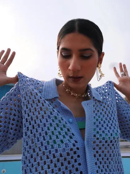 A close-up from a creative shoot I styled for crochet brand Rasti India. The focus is on the texture of the knitwear and playful accessories.