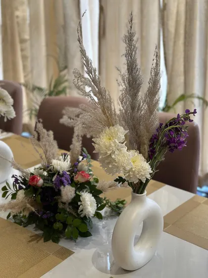 A close-up of the modern floral arrangements used in the dining area.