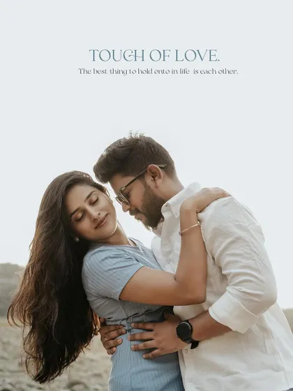 An intimate embrace on a rocky shore, captioned "Touch of Love."