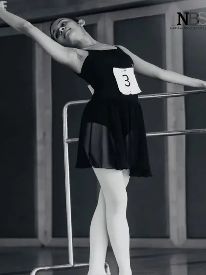 A shot from an audition or exam. The number pinned to my leotard is a familiar sight for any serious dancer.
