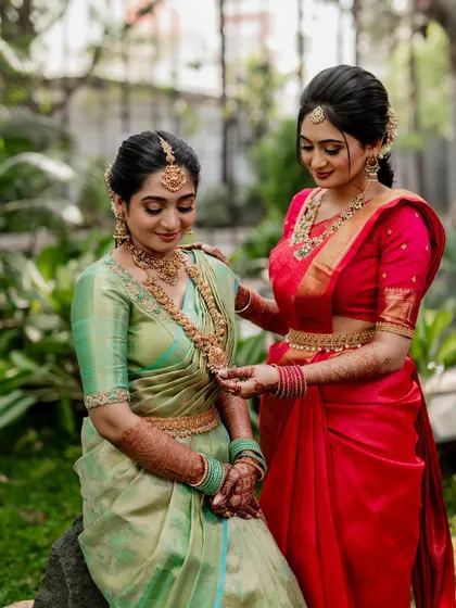 A tender moment between the couple, showcasing their beautiful coordinated outfits. Our goal is to capture the subtle emotions and details that make your wedding portraits special.
