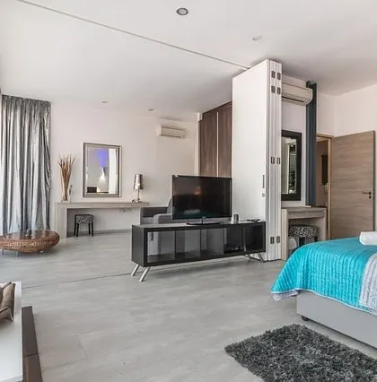 A modern studio apartment painted in clean white and grey tones. My painting services help create a seamless and spacious feel, even in smaller homes.