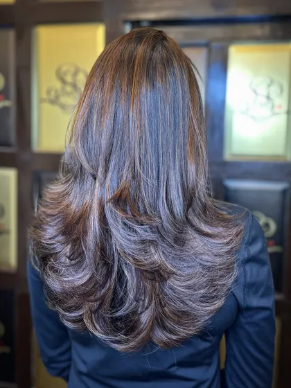Another look at these warm copper tones, showing the incredible dimension and shine after a professional colour service and blowout.