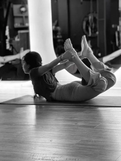 The Bow Pose (Dhanurasana) is an excellent backbend for strengthening the back muscles and improving posture. Here, a student demonstrates the pose with focus and control.