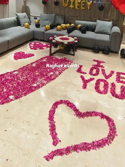 Another angle of the romantic birthday surprise. The floor is covered in rose petals forming a pathway and hearts, creating a truly memorable experience.
