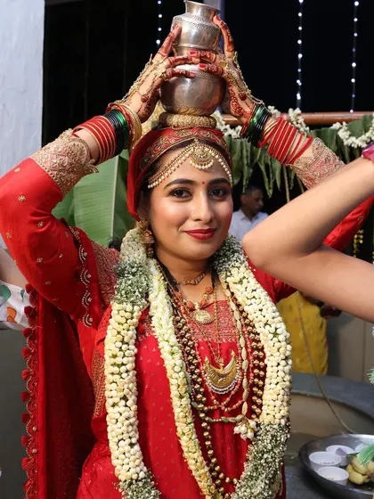 A duplicate of the previous image, showing the bride during a traditional ritual.