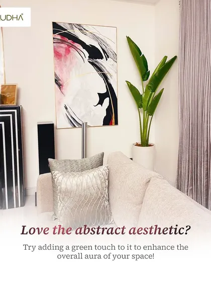 Love the abstract aesthetic? I suggest adding a green touch to enhance the overall aura. A tall Bird of Paradise plant, for example, can complement modern art and furniture beautifully.