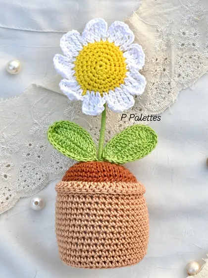 Our crochet daisy pot is perfect for adding a touch of innocence and charm to any space.